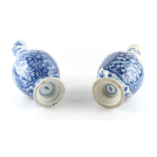 104 - Property of a lady - two similar Chinese blue & white bottle vases, probably Kangxi period (1662-172... 