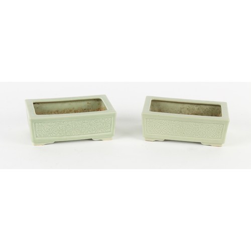 112 - Property of a lady - a pair of early 20th century Chinese celadon ground rectangular planters, with ... 