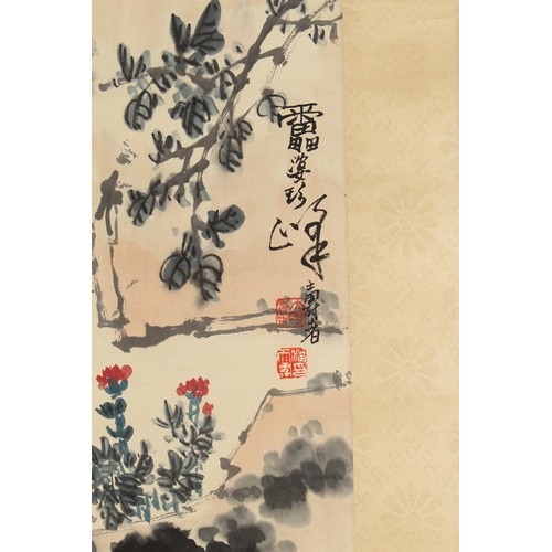 62 - A Chinese scroll painting on paper depicting a crow perched above trailing flowers, signed with call... 