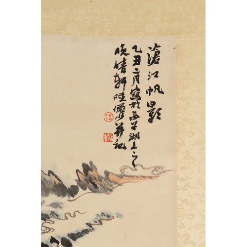 63 - A Chinese scroll painting on paper depicting a mountainous landscape, signed with calligraphy and tw... 