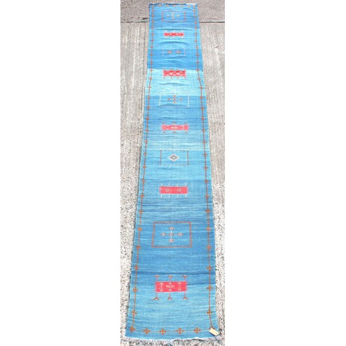 178 - Property of a lady - a long Moroccan hand-knotted wool flat weave runner, with blue ground, 201 by 2... 