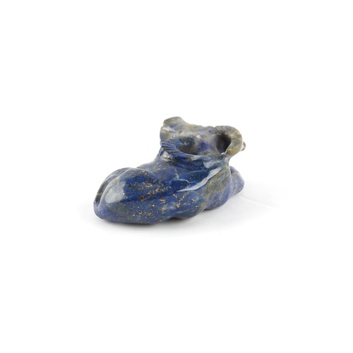 17 - A Chinese carved lapis lazuli model of a Recumbent Buffalo, 2.2ins. (5.6cms.) long.