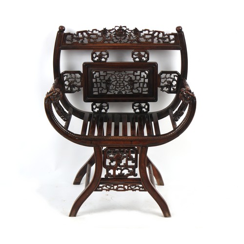 67 - A late 19th century Chinese carved hongmu armchair, the arms carved in relief with prunus, with drag... 