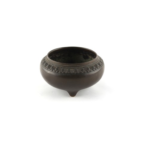 4 - An 18th century Chinese bronze tripod censer with decorative relief band, 3-character mark to base, ... 