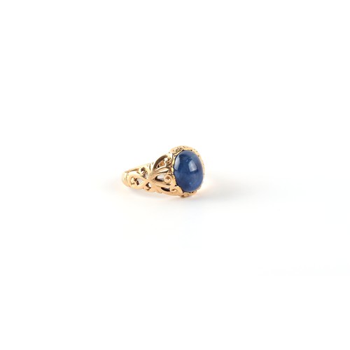 53 - A yellow gold cabochon sapphire ring, the oval cabochon sapphire weighing approximately 4.82 carats,... 