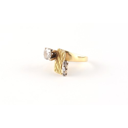 37 - Property of a deceased estate - a modern yellow gold (tests 18ct) diamond ring, the larger round bri... 