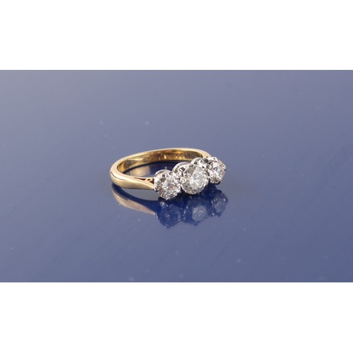 26 - An 18ct yellow gold diamond three stone ring, the estimated total diamond weight 1.05 carats, size I... 