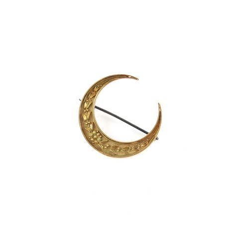 34 - Property of a lady - an unmarked gold (tests 15ct) crescent brooch, the pin steel, approximately 40m... 