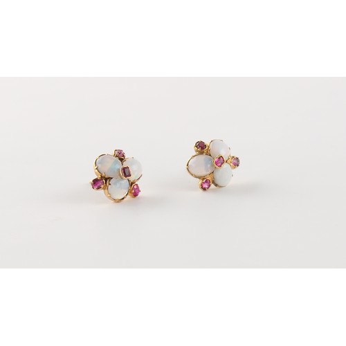 46 - A pair of unmarked yellow gold oval opal & ruby flowerhead stud earrings, each approximately 11mm ac... 