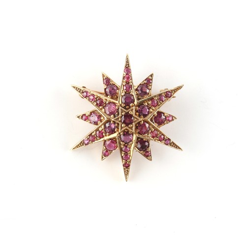 32 - A 9ct yellow gold ruby star brooch, the round cut rubies weighing a total of approximately 4.20 cara... 