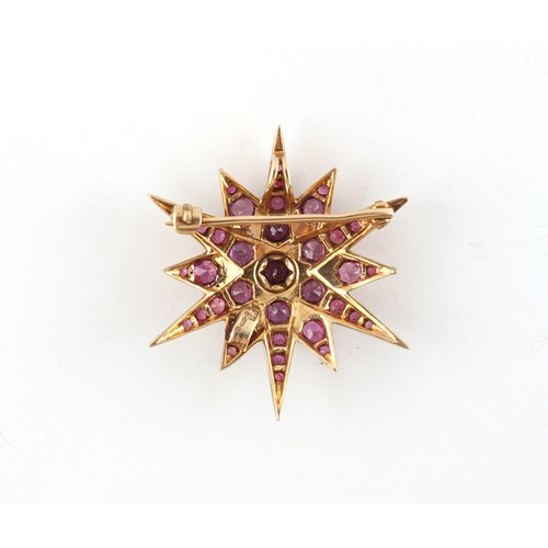 32 - A 9ct yellow gold ruby star brooch, the round cut rubies weighing a total of approximately 4.20 cara... 