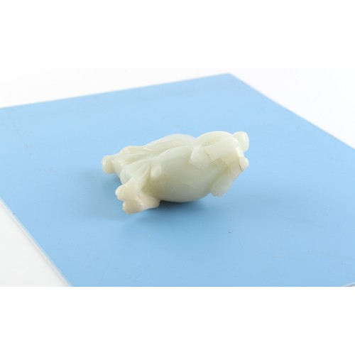 186 - A Chinese carved white jade model of a Rabbit, probably 20th century, 3ins. (7.6cms.) long, 2.3ins. ... 