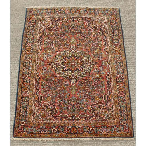 206 - Property of a gentleman - a Persian hand-knotted wool rug, with navy ground, 81 by 58ins. (206 by 14... 