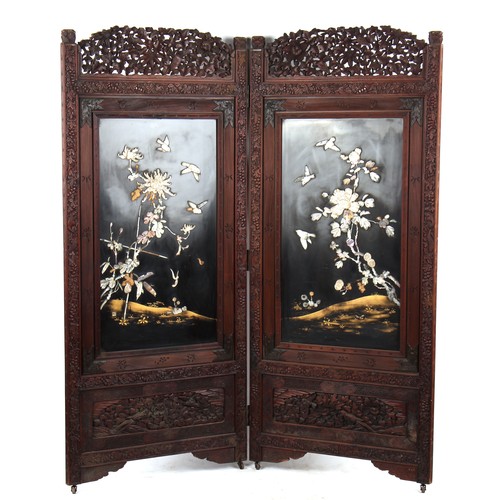 172 - Property of a gentleman - a late 19th century Japanese Meiji period carved two fold screen with moth... 