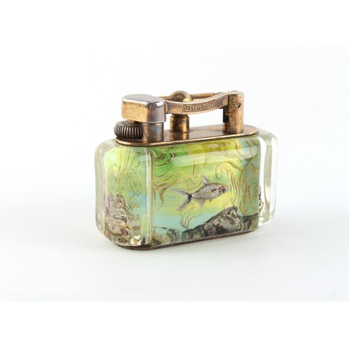 181 - Property of a gentleman - a Dunhill Aquarium table lighter, 3.85ins. (9.8cms.) long.