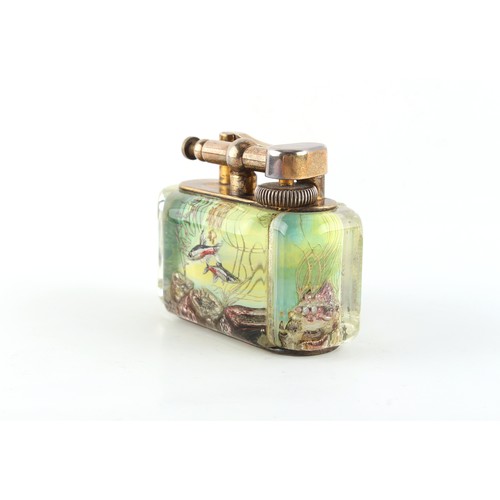 181 - Property of a gentleman - a Dunhill Aquarium table lighter, 3.85ins. (9.8cms.) long.