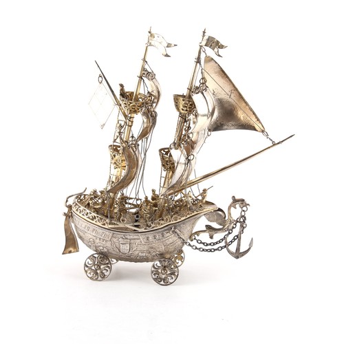 204 - Property of a lady - a late 19th century Continental silver model of a galleon or neff, with crew on... 