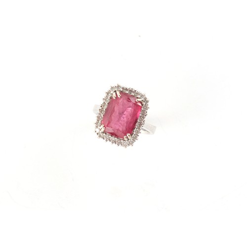 133 - An 18ct white gold pink stone (probably pink tourmaline) & diamond ring, the pink stone measuring ap... 