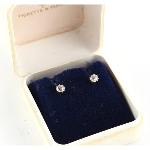 127 - Property of a deceased estate - a pair of platinum or white gold diamond stud earrings, the two roun... 