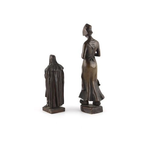 264 - Property of a lady - a late 19th / early 20th century patinated bronze figure of a maid modelled wal... 