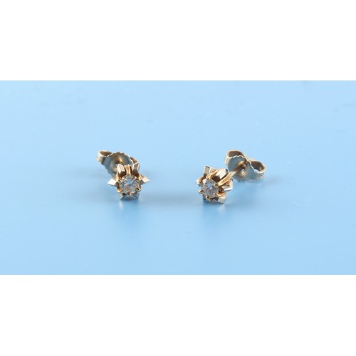 137 - Property of a lady - a pair of 18ct yellow gold diamond stud earrings, each round brilliant cut diam... 