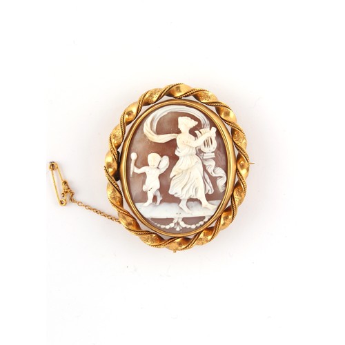 81 - Property of a lady - a Victorian gilt metal oval framed carved shell cameo brooch, with rope border,... 