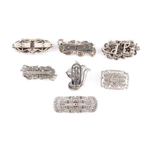 32 - Property of a lady - a group of seven clear paste brooches including four double clip brooches, two ... 