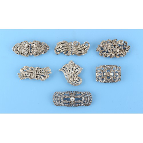 32 - Property of a lady - a group of seven clear paste brooches including four double clip brooches, two ... 