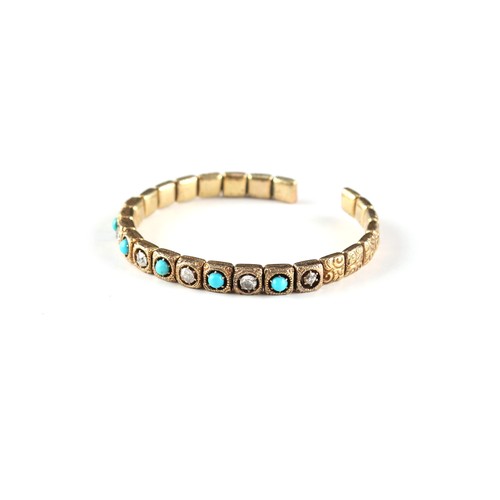 115 - An unmarked yellow gold diamond & turquoise torc bangle, the estimated total diamond weight 0.60 car... 