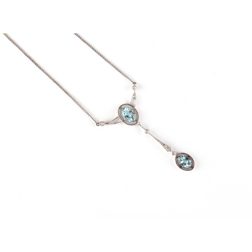 134 - An aquamarine & diamond pendant on chain necklace, the two oval cut aquamarines weighing approximate... 