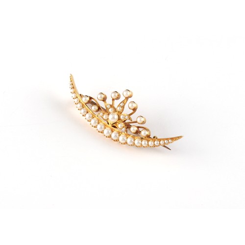 152 - An early 20th century unmarked yellow gold (tests 14/15ct) seed pearl crescent brooch, 51mm long, ap... 