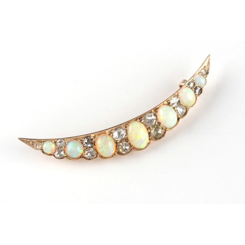 155 - An unmarked yellow gold opal & diamond crescent brooch, the diamonds with closed back settings, the ... 