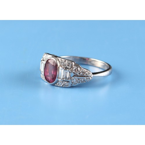 129 - An Art Deco style white gold ruby & diamond ring, the oval cut ruby weighing approximately 1.25 cara... 