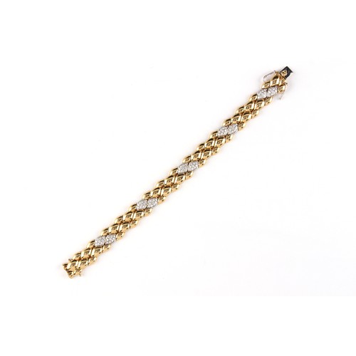 161 - An 18ct yellow gold & diamond link bracelet, the round cut diamonds weighing a total of approximatel... 