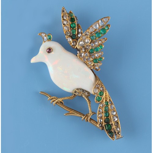 162 - A carved opal emerald & diamond brooch modelled as a bird perched on a branch, in yellow gold settin... 