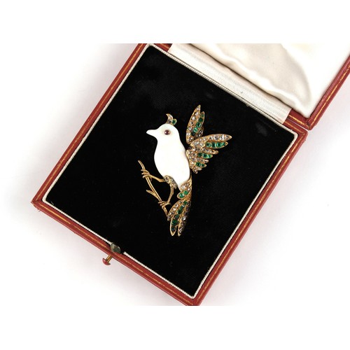 162 - A carved opal emerald & diamond brooch modelled as a bird perched on a branch, in yellow gold settin... 