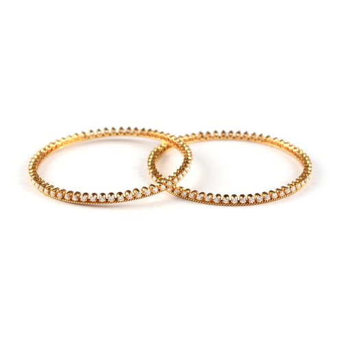 158 - A pair of unmarked yellow gold (test 18ct) diamond bangles, designed to be worn individually or side... 