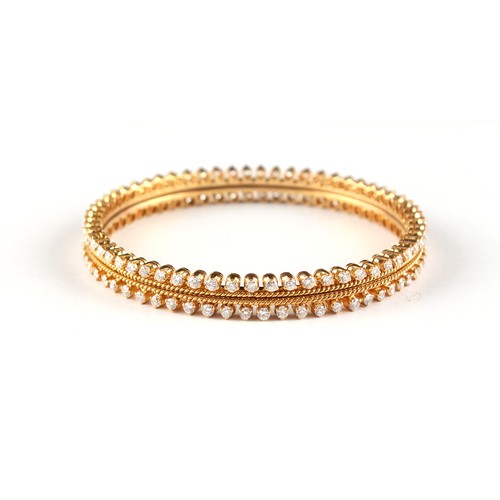 158 - A pair of unmarked yellow gold (test 18ct) diamond bangles, designed to be worn individually or side... 