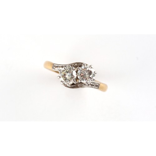 159 - An 18ct yellow gold diamond crossover ring, the estimated total diamond weight 0.64 carat, size J.