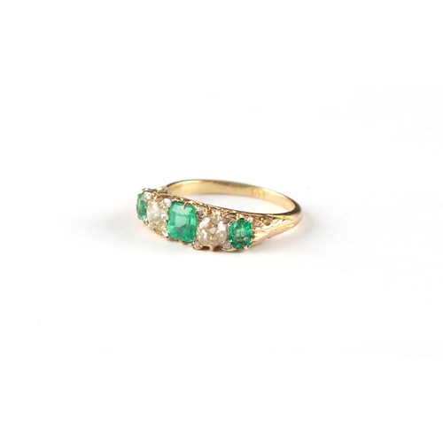 140 - An 18ct yellow gold emerald & diamond five stone ring, the three emeralds weighing an estimated tota... 