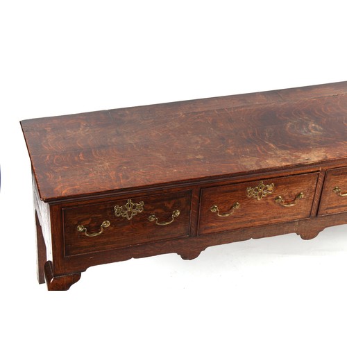 306 - Property of a lady - a mid 18th century George II / III oak dresser base with four fruitwood banded ... 