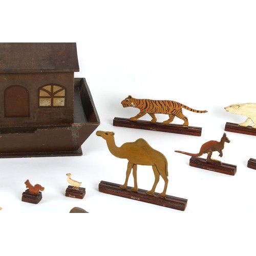 283 - Property of a lady - a late 19th / early 20th century painted wood Noah's Ark with cut-out animals, ... 