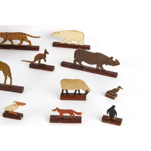 283 - Property of a lady - a late 19th / early 20th century painted wood Noah's Ark with cut-out animals, ... 