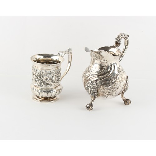 212 - Property of a gentleman - a George III silver baluster milk jug, later repousse decoration, on ball ... 