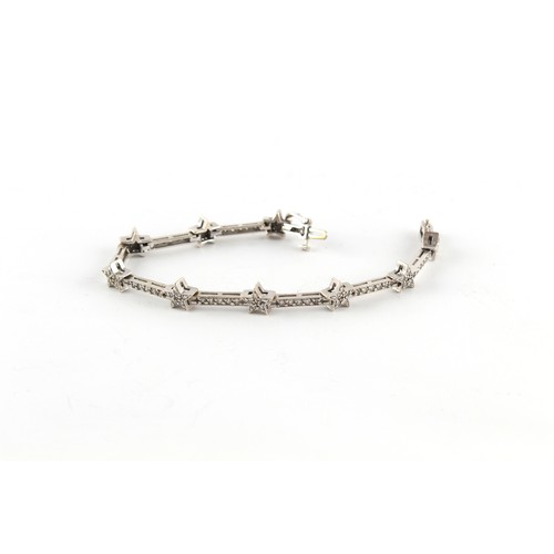 67 - Property of a lady - a 14ct white gold diamond link bracelet, one diamond missing at clasp, the esti... 