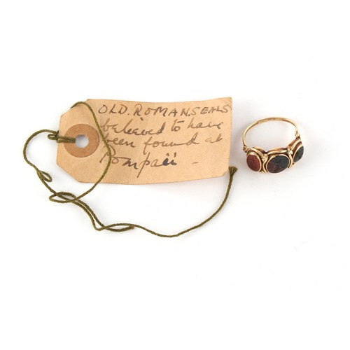 146 - Property of a gentleman - antiquities - a 19th century unmarked gold ring set with three Roman intag... 