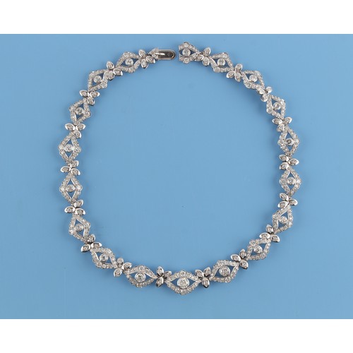 131 - A fine 18ct white gold (tested) diamond link necklace, the round brilliant cut diamonds weighing an ... 