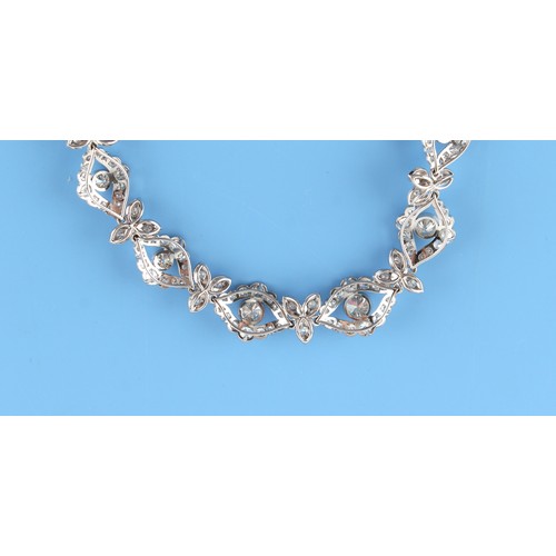 131 - A fine 18ct white gold (tested) diamond link necklace, the round brilliant cut diamonds weighing an ... 