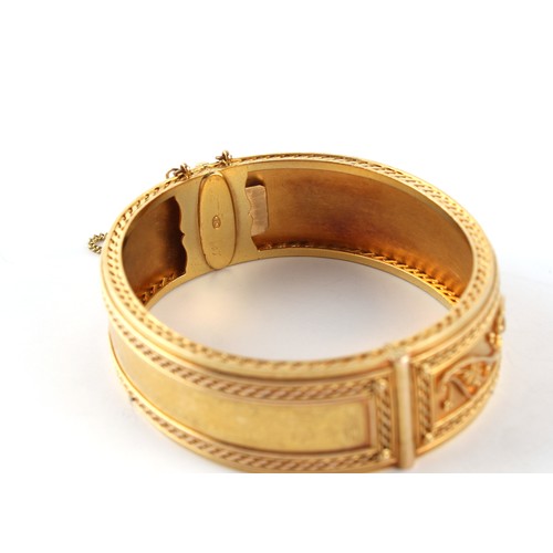 154 - Carlo Giuliano (1831-1895) - a Victorian finely worked unmarked high carat gold hinged bangle, 'CG' ... 