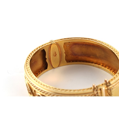 154 - Carlo Giuliano (1831-1895) - a Victorian finely worked unmarked high carat gold hinged bangle, 'CG' ... 